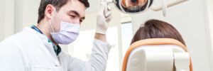 Dentist treating patient in dental chair